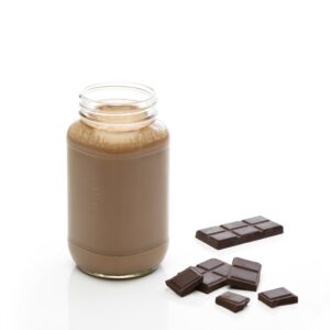 Chocolate shake in a glass jar with chocolate pieces